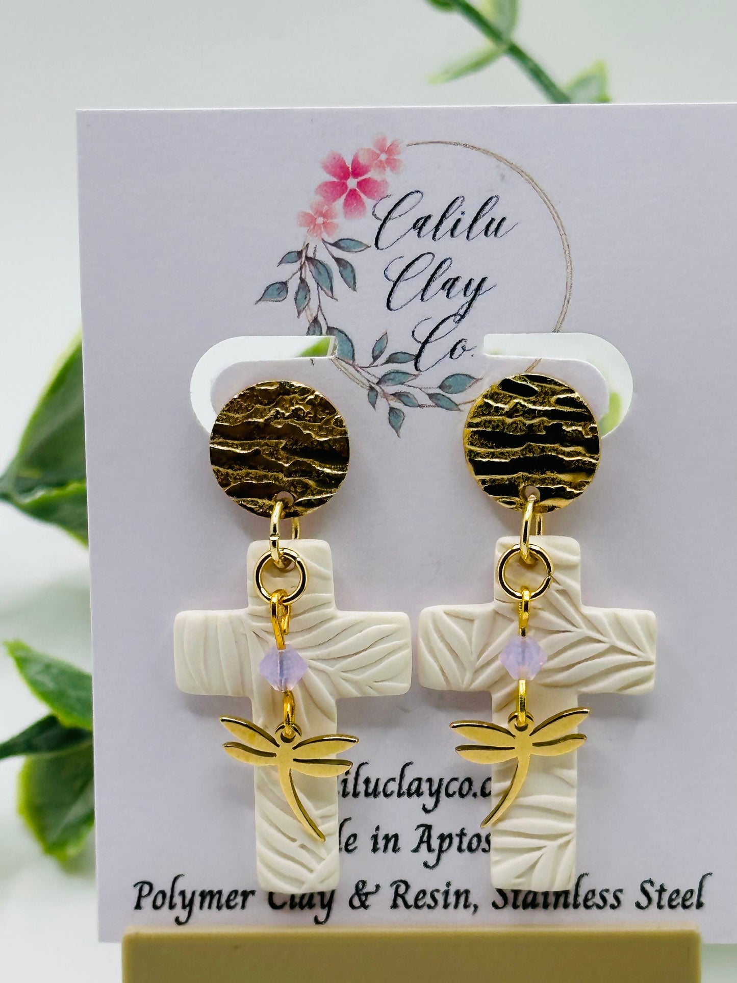 White Leaf Embossed Cross with Dragonflies Dangles