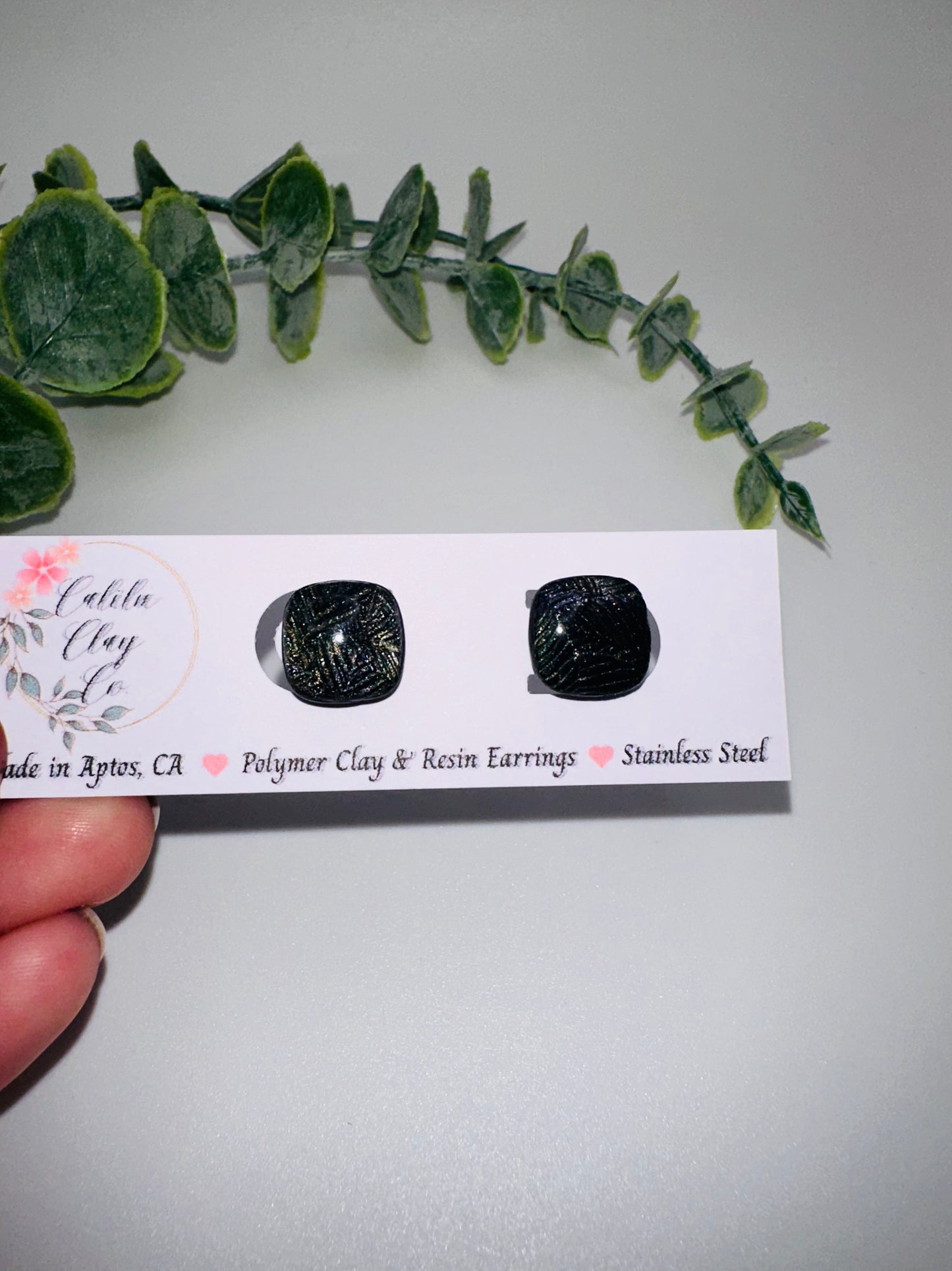 Black Rounded Square Studs with Shimmery Leaf Pattern