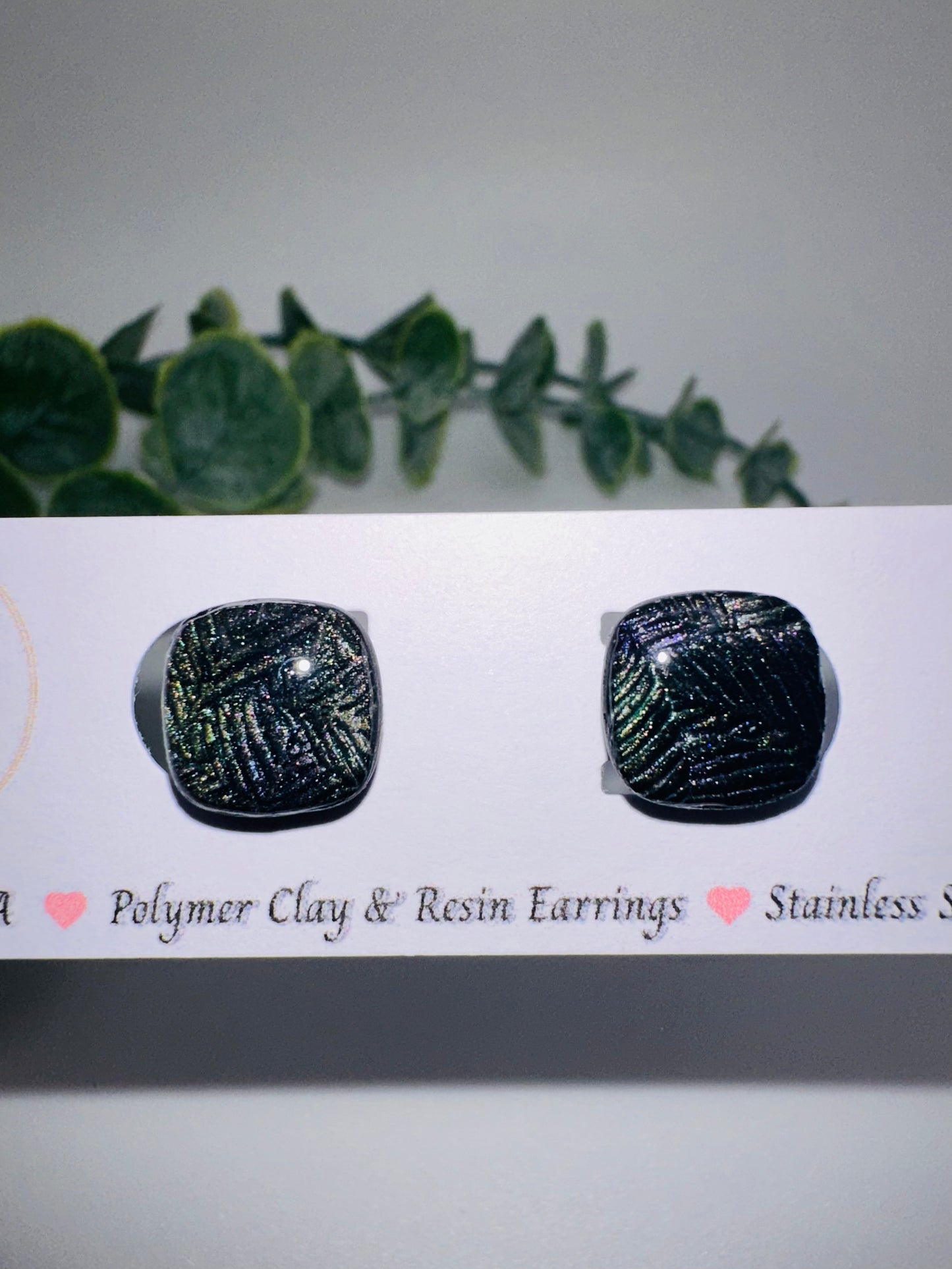 Black Rounded Square Studs with Shimmery Leaf Pattern